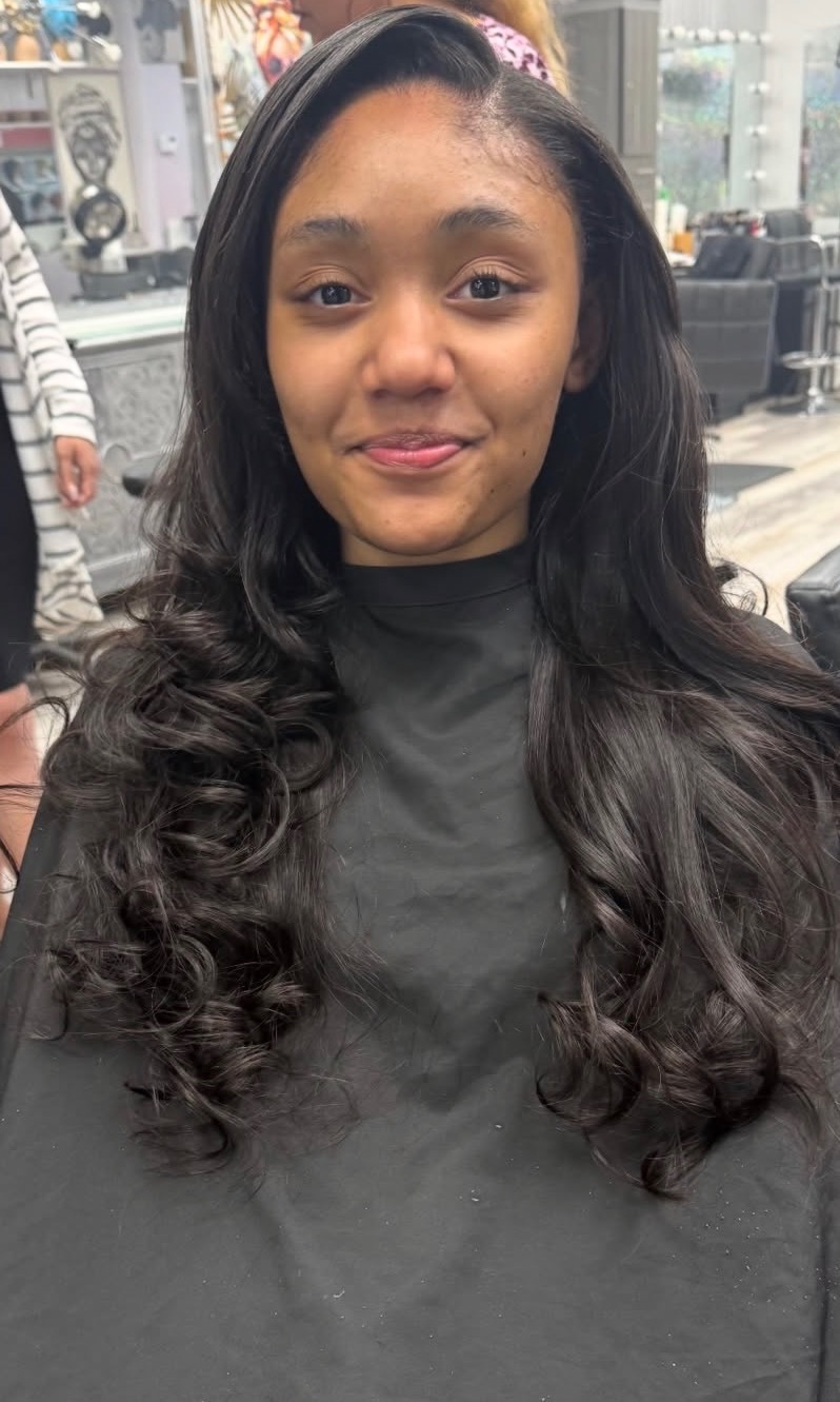 Sew-in weave with smooth roots and soft curls at Lovette Hair